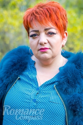 Ukrainian mail order bride Helena from Odessa with red hair and green eye color - image 1