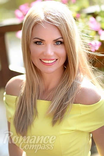 Ukrainian mail order bride Yana from Kharkov with blonde hair and blue eye color - image 1