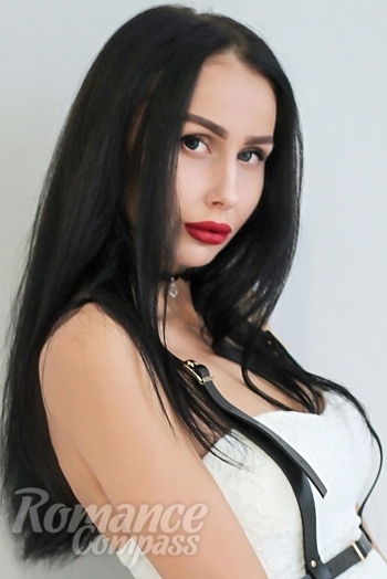 Ukrainian mail order bride Daria from Moscow with black hair and green eye color - image 1