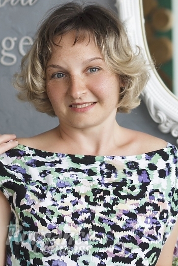 Ukrainian mail order bride Eugeniya from Nikolaev with light brown hair and blue eye color - image 1