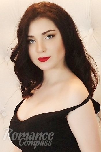 Ukrainian mail order bride Lyudmila from Kiev with brunette hair and blue eye color - image 1