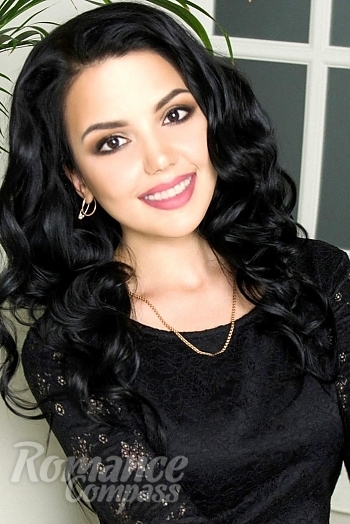 Ukrainian mail order bride Zhanna from Kiev with black hair and hazel eye color - image 1