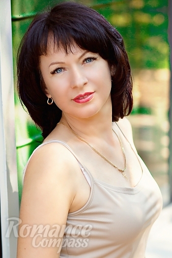 Ukrainian mail order bride Ludmila from Nikopol with brunette hair and blue eye color - image 1