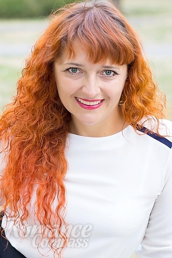 Ukrainian mail order bride Oksana from Nikolaev with red hair and green eye color - image 1