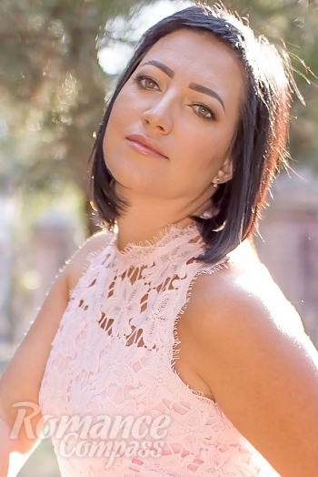 Ukrainian mail order bride Natalya from Berdyansk with black hair and green eye color - image 1