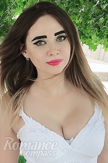 Ukrainian mail order bride Kristina from Kharkiv with light brown hair and green eye color - image 1