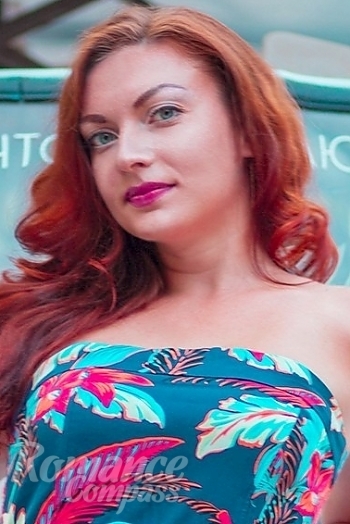 Ukrainian mail order bride Irina from Odessa with red hair and blue eye color - image 1