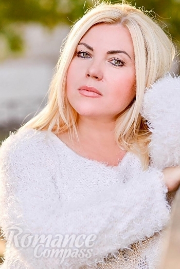 Ukrainian mail order bride Irina from Dnipro with blonde hair and black eye color - image 1