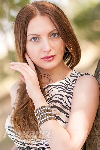 Ukrainian mail order bride Olga from Kyiv with light brown hair and blue eye color - image 1