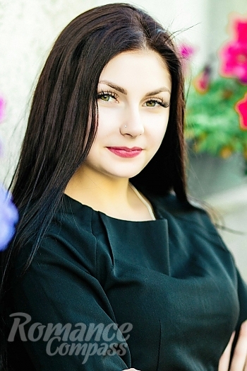 Ukrainian mail order bride Oksana from Kiev with black hair and green eye color - image 1
