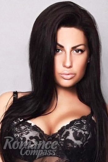 Ukrainian mail order bride Kristina from Zaporozhye with black hair and green eye color - image 1