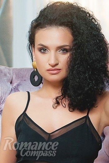Ukrainian mail order bride Anastasiya from Kiev with black hair and green eye color - image 1
