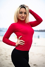 Ukrainian mail order bride Bogdana from Kremenchuk with light brown hair and blue eye color - image 12