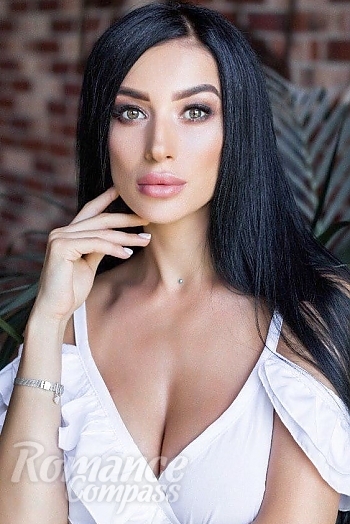 Ukrainian mail order bride Karina from Kiev with black hair and green eye color - image 1