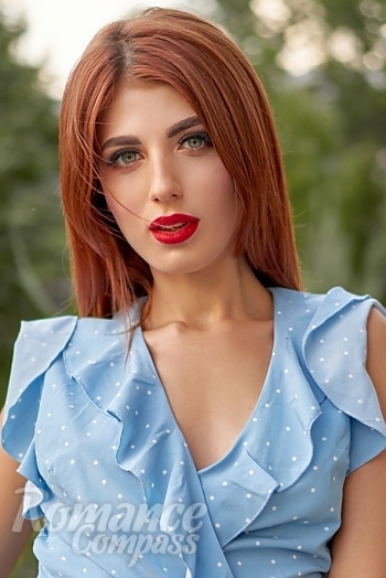 Ukrainian mail order bride Julia from Nikolaev with red hair and green eye color - image 1