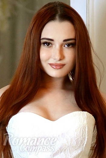 Ukrainian mail order bride Anna from Kiev with red hair and black eye color - image 1