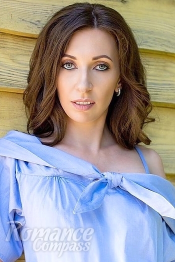 Ukrainian mail order bride Olga from Kiev with light brown hair and green eye color - image 1