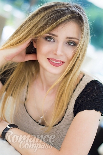 Ukrainian mail order bride Svetlana from Kiev with blonde hair and green eye color - image 1