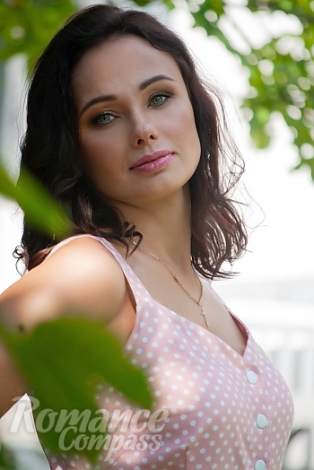 Ukrainian mail order bride Yana from Poltava with black hair and green eye color - image 1