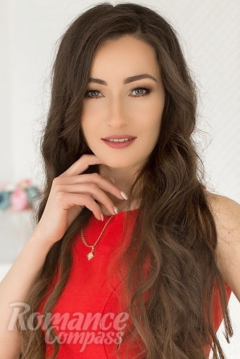 Ukrainian mail order bride Oksana from Kyiv with light brown hair and green eye color - image 1