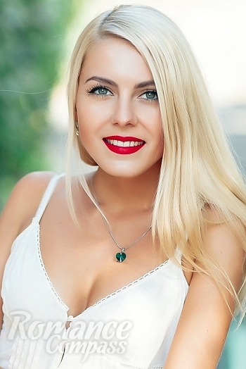 Ukrainian mail order bride Tatyana from Nikolaev with blonde hair and blue eye color - image 1