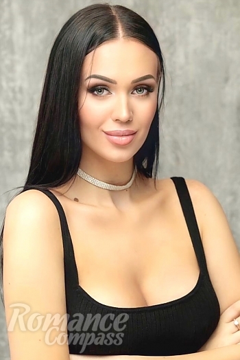 Ukrainian mail order bride Larisa from Kharkov with black hair and green eye color - image 1