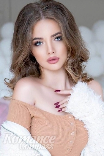 Ukrainian mail order bride Ivanna from Kiev with light brown hair and blue eye color - image 1