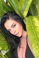 Ukrainian mail order bride Roxolana from Lvov with black hair and hazel eye color - image 14