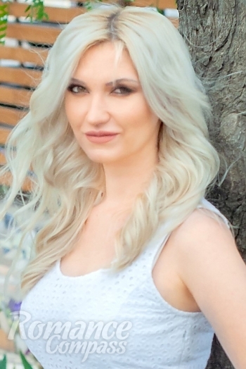 Ukrainian mail order bride Irina from Odesa with blonde hair and green eye color - image 1