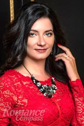 Ukrainian mail order bride Olga from Odesa with black hair and blue eye color - image 1