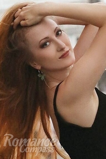 Ukrainian mail order bride Elena from Kyiv with red hair and green eye color - image 1