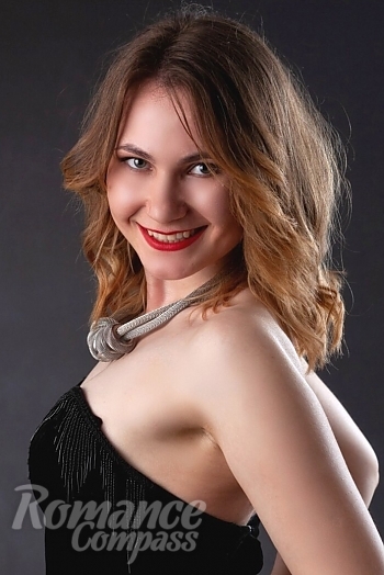 Ukrainian mail order bride Yuliia from Kiev with light brown hair and green eye color - image 1
