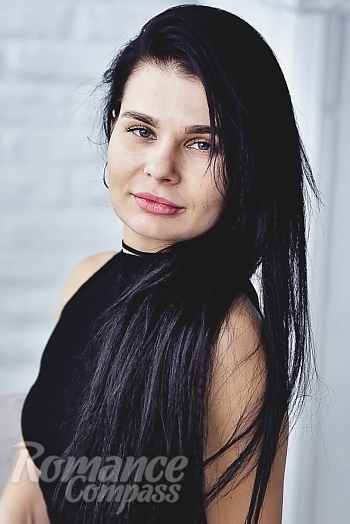 Ukrainian mail order bride Oksana from Lutsk with black hair and hazel eye color - image 1