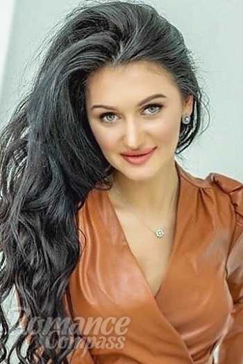Ukrainian mail order bride Inna from Kyiv with black hair and green eye color - image 1