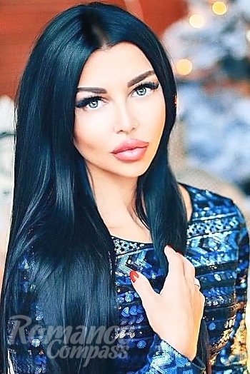 Ukrainian mail order bride Olga from Kharkov with black hair and green eye color - image 1