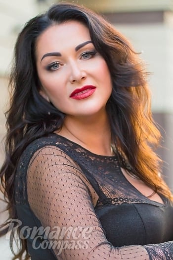 Ukrainian mail order bride Oksana from Dnipro with brunette hair and blue eye color - image 1