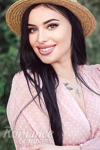 Ukrainian mail order bride Yana from Kiev with black hair and green eye color - image 1