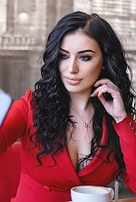 Ukrainian mail order bride Yana from Kiev with black hair and green eye color - image 2