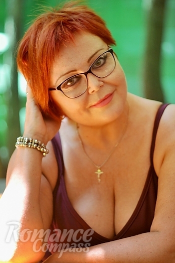 Ukrainian mail order bride Larisa from Kiev with red hair and green eye color - image 1