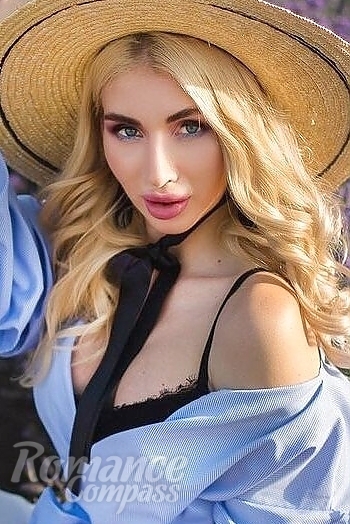 Ukrainian mail order bride Oksana from Kharkiv with light brown hair and blue eye color - image 1