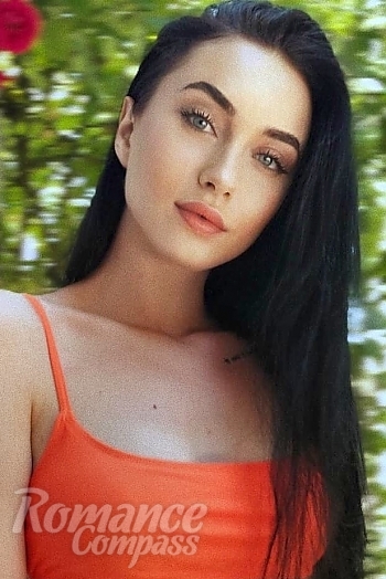 Ukrainian mail order bride Anna from Kiev with black hair and green eye color - image 1