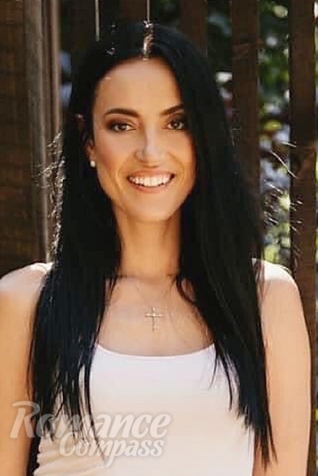 Ukrainian mail order bride Nelli from Kiev with black hair and hazel eye color - image 1