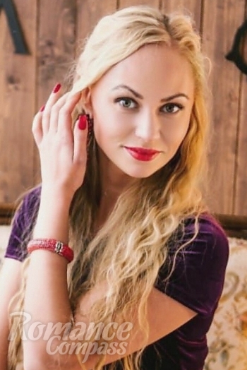 Ukrainian mail order bride Olga from Kiev with blonde hair and blue eye color - image 1