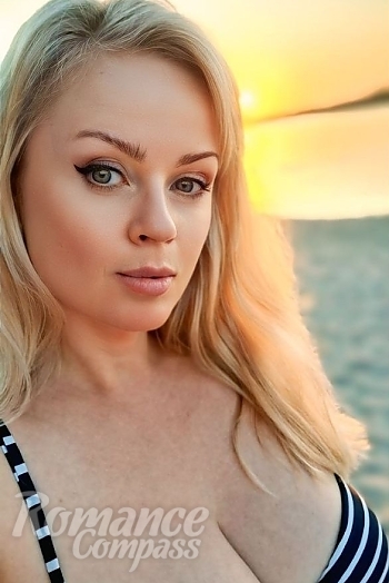 Ukrainian mail order bride Nataliia from Nikolaev with blonde hair and grey eye color - image 1