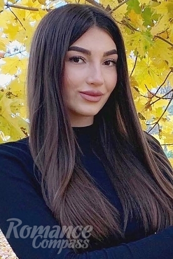 Ukrainian mail order bride Karina from Kamenets Podolsk with black hair and green eye color - image 1