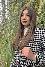Ukrainian mail order bride Karina from Kamenets Podolsk with black hair and green eye color - image 13