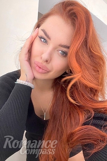 Ukrainian mail order bride Ruslana from Odessa with red hair and green eye color - image 1