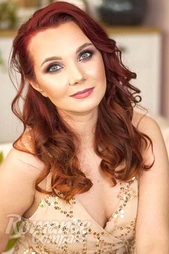 Ukrainian mail order bride Yulia from Odessa with red hair and blue eye color - image 1
