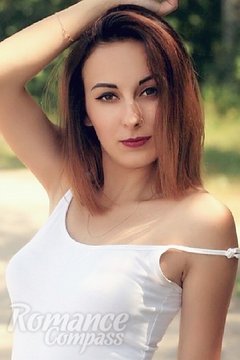 Ukrainian mail order bride Angelina from Nikolaev with light brown hair and hazel eye color - image 1