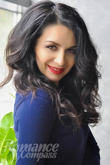 Ukrainian mail order bride Olga from Cherkassy with black hair and green eye color - image 1